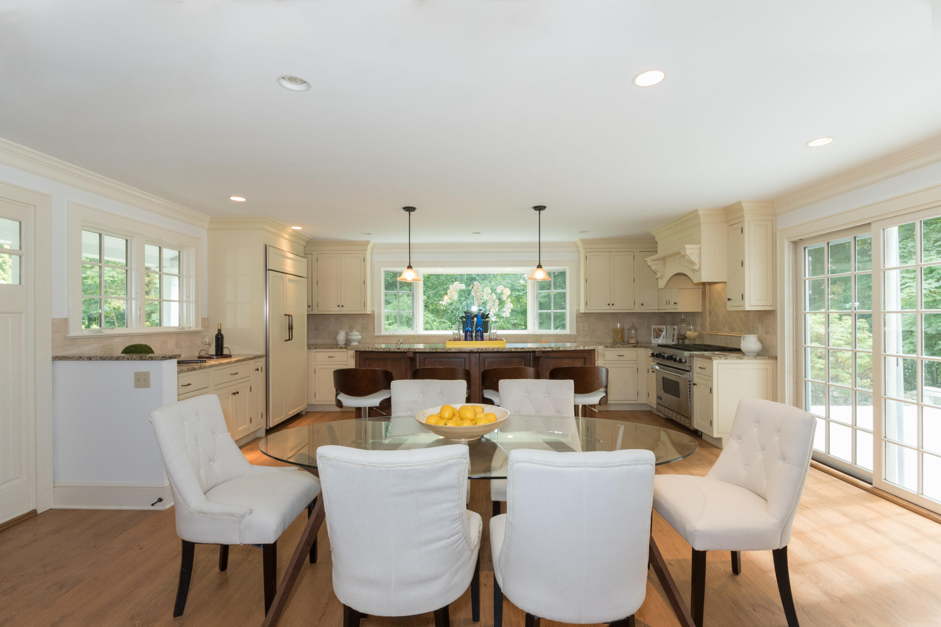 55 Cedar Gate Road Darien, CT 06820 - Photo 9 of 41 a dining room with furniture a window and wooden floor