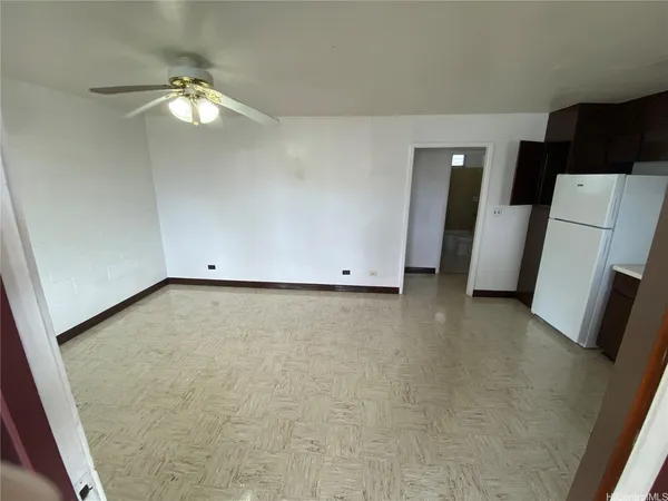 a view of an empty room with a fireplace