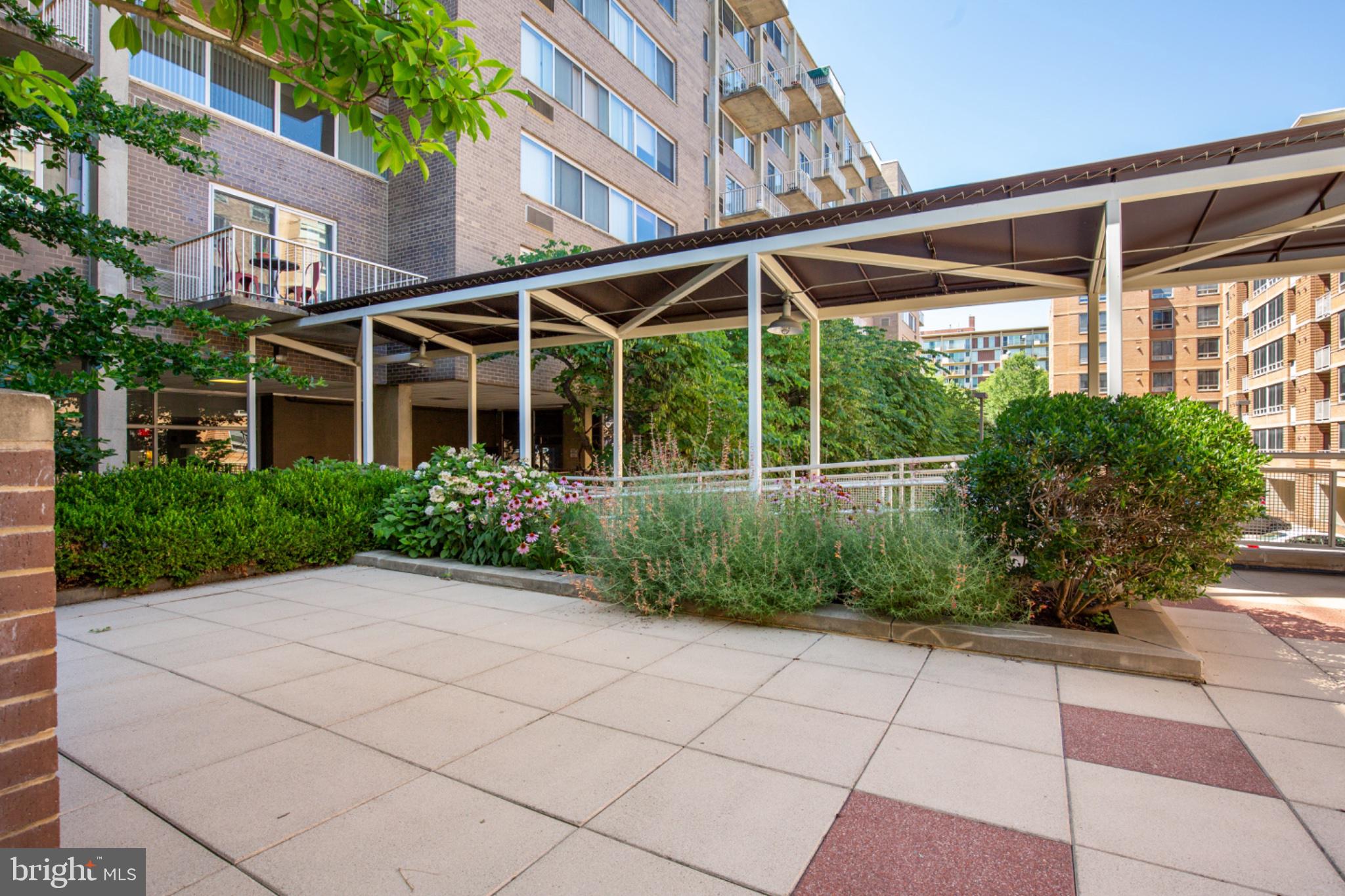 350 G Street Southwest, Unit N423 Washington, DC 20024 - Photo 28 of 43 Serene courtyard with lush greenery.