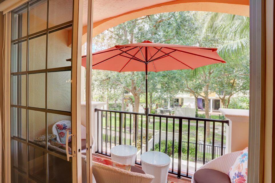5645 Northeast Trieste Way Boca Raton, FL 33487 - Photo 11 of 38 a view of a two chairs in the balcony