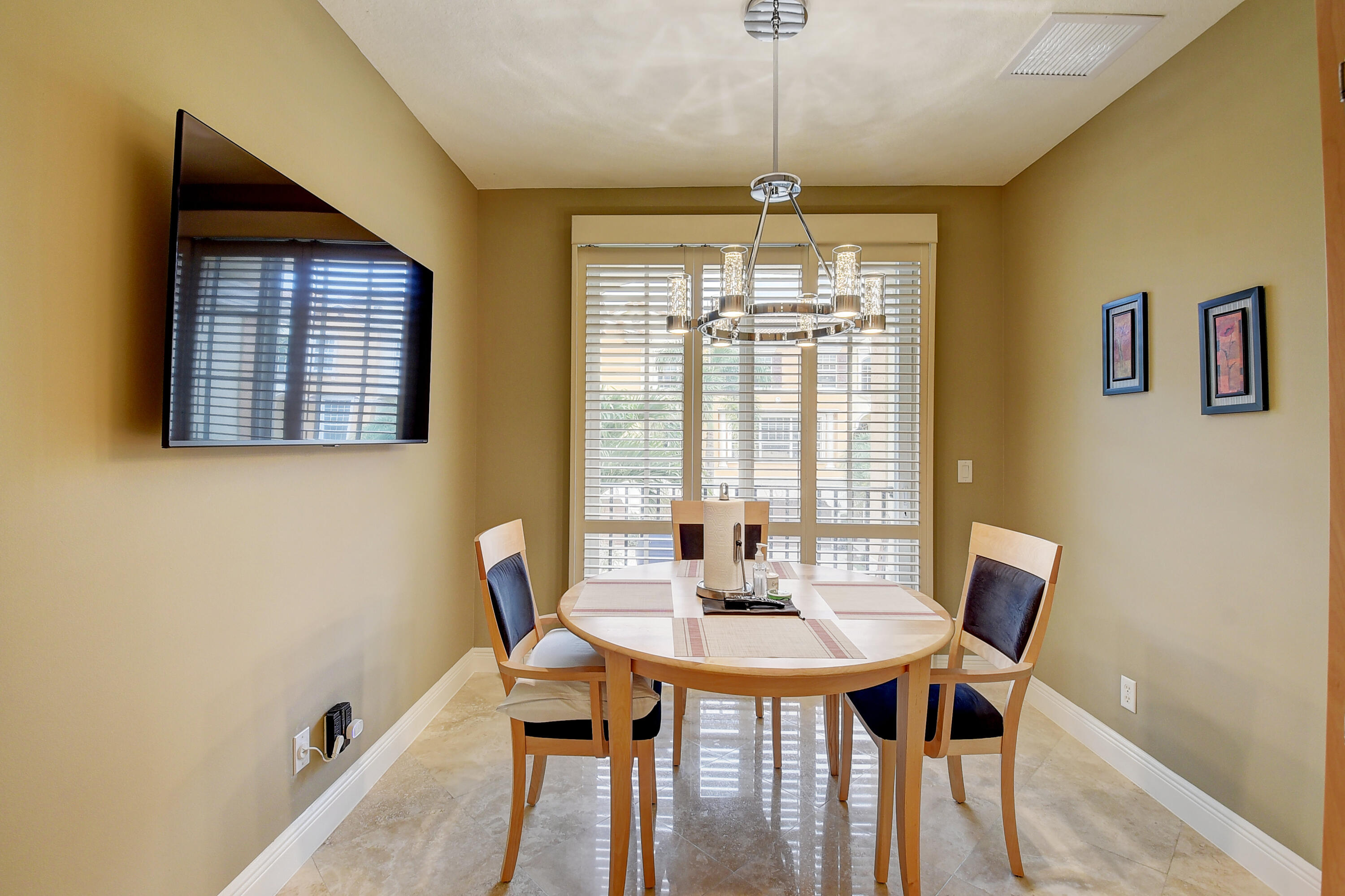 5645 Northeast Trieste Way Boca Raton, FL 33487 - Photo 16 of 38 a view of a dining room with furniture and window