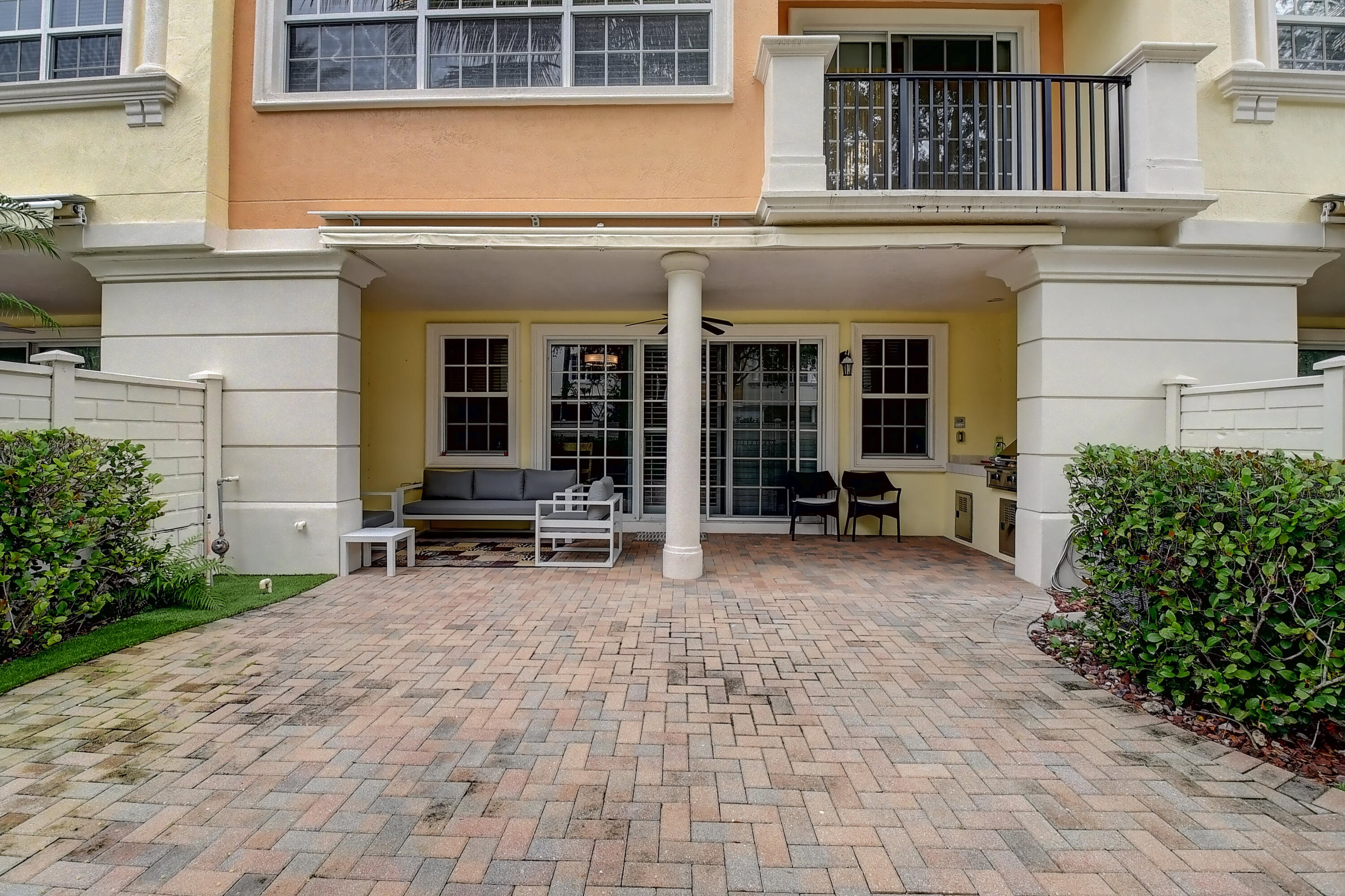 5645 Northeast Trieste Way Boca Raton, FL 33487 - Photo 32 of 38 a view of a house with outdoor seating
