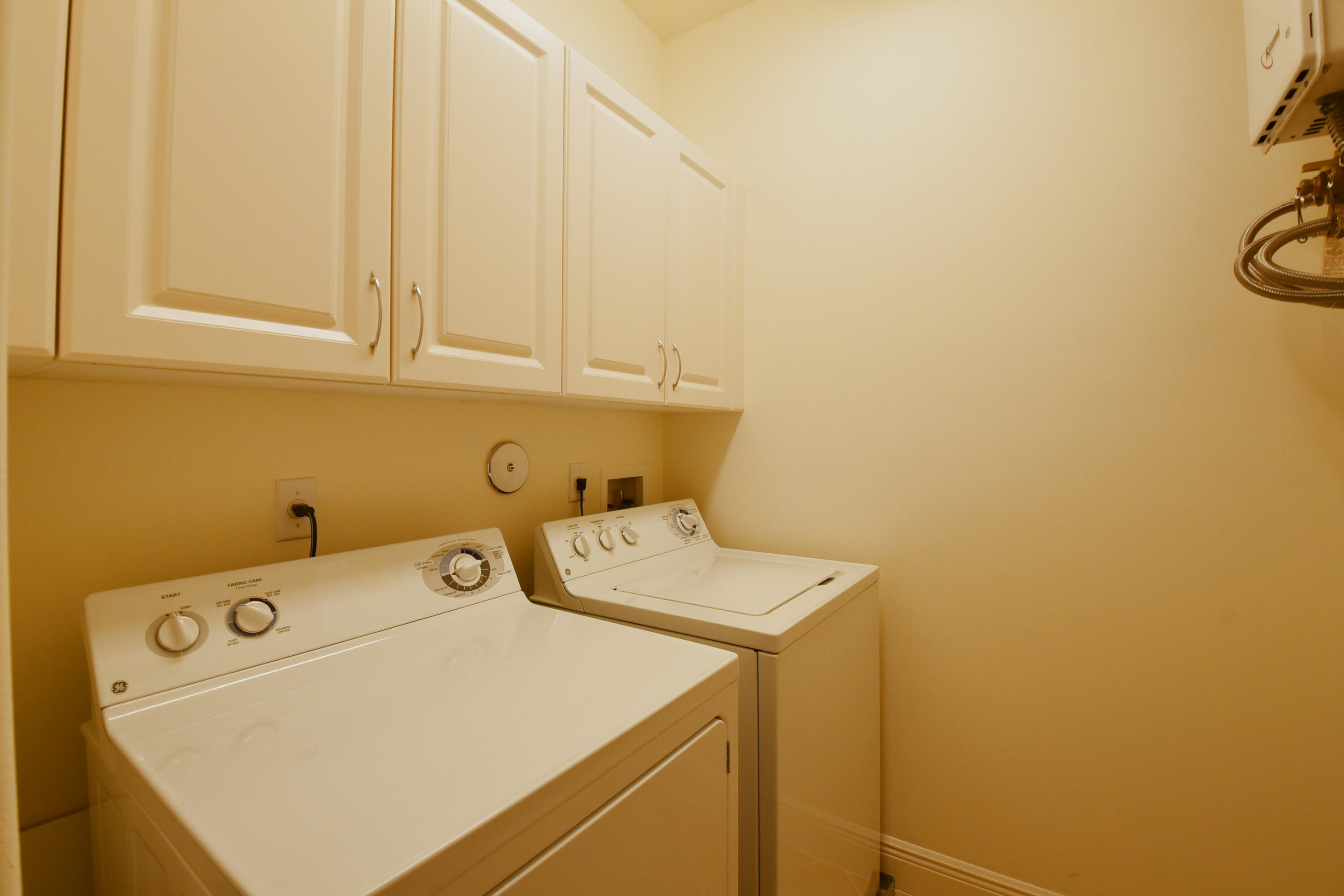 5645 Northeast Trieste Way Boca Raton, FL 33487 - Photo 33 of 38 a utility room with dryer and washer