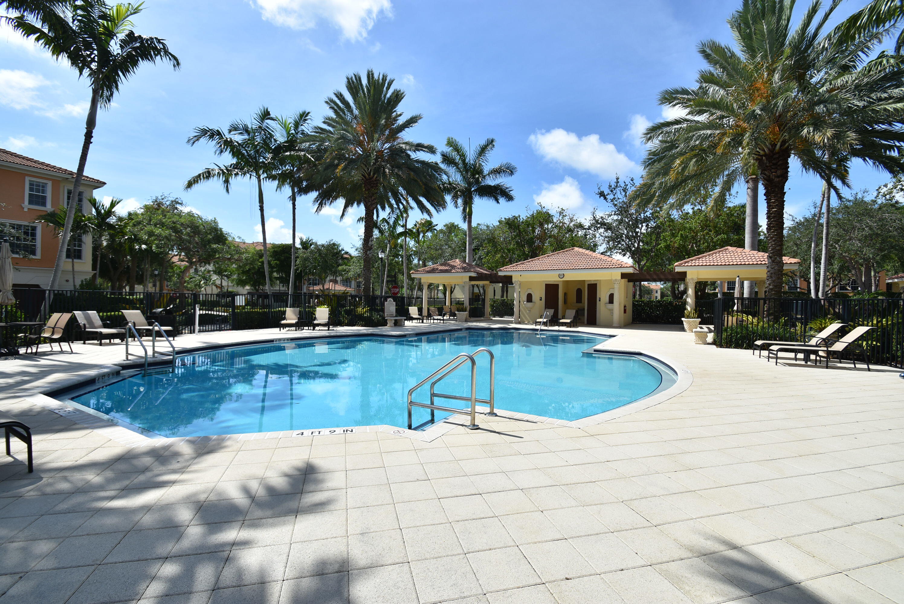 5645 Northeast Trieste Way Boca Raton, FL 33487 - Photo 37 of 38 a view of swimming pool with palm trees