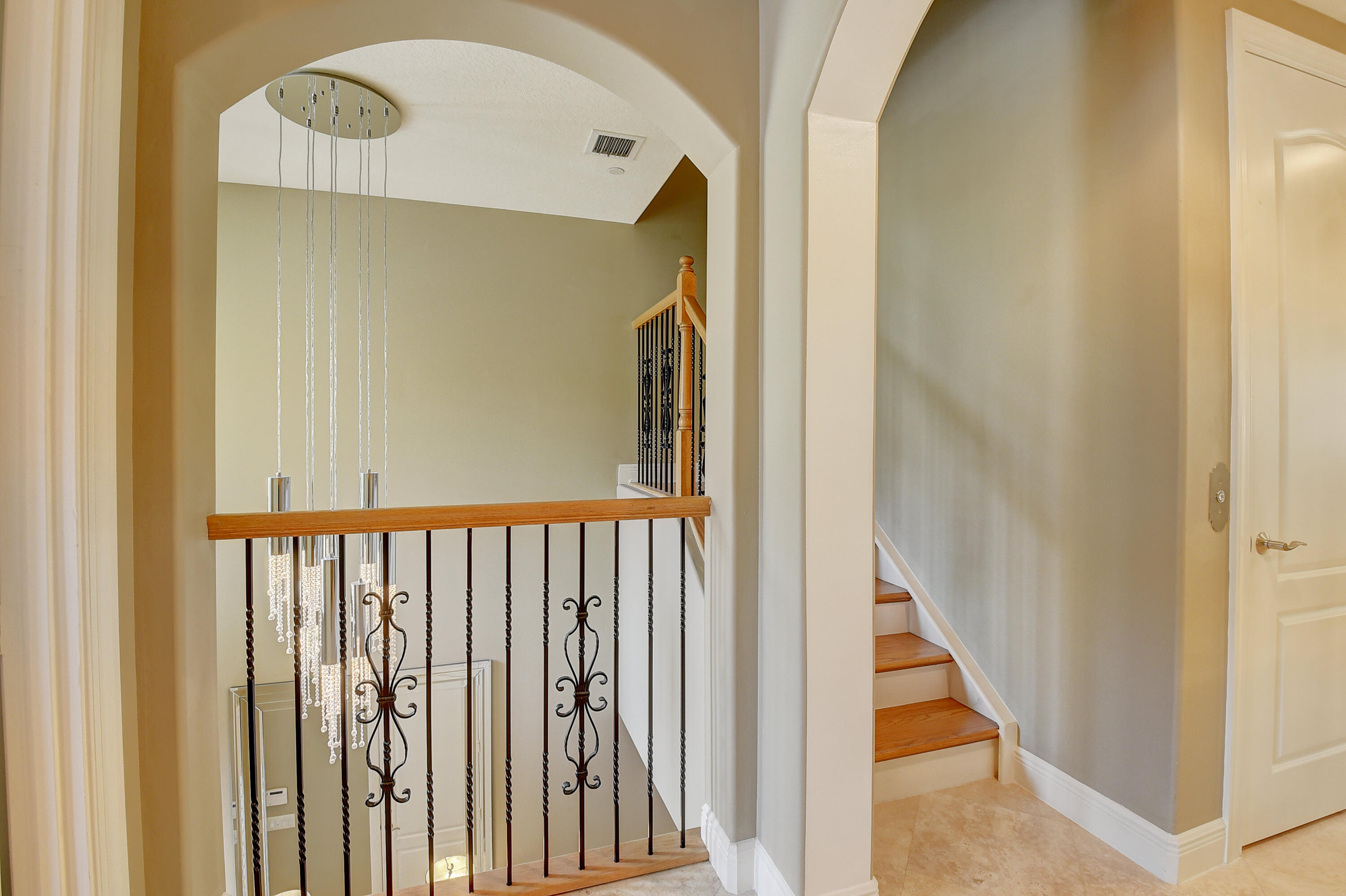 5645 Northeast Trieste Way Boca Raton, FL 33487 - Photo 6 of 38 a view of a porch with wooden floor