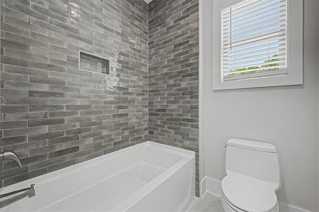 217 Laura Lake Road Marietta, GA 30066 - Photo 46 of 54 a bathroom with a toilet and a bathtub