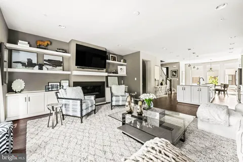 a kitchen with stainless steel appliances a stove a refrigerator and cabinets