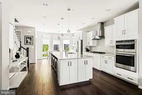 a bathroom with a sink a mirror and a shower