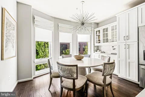 a spacious bathroom with a double vanity sink a mirror and a shower