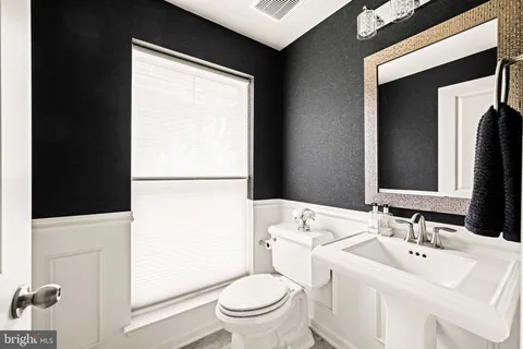 a view of entryway with wooden floor and stairs