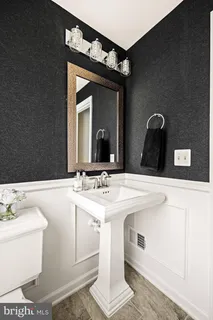 a view of a livingroom with furniture and a flat screen tv