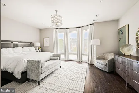 a bedroom with a bed and a table