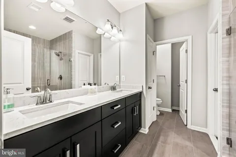 a picture of a bench in front of a wall