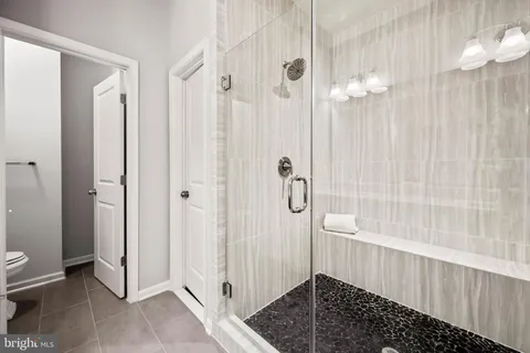 a view of a lake with couches in the background