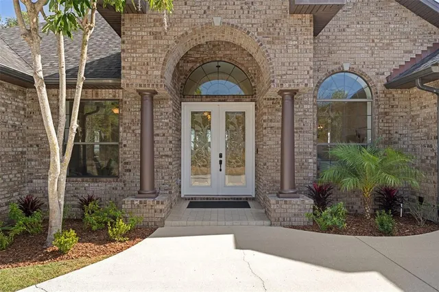 a view of a dining room with furniture and window