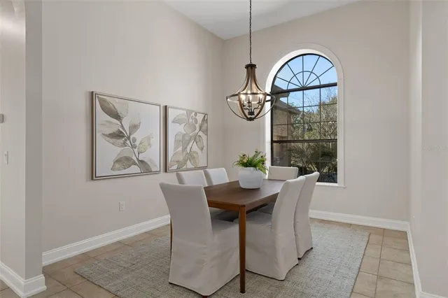a spacious bathroom with a granite countertop tub a sink and a mirror