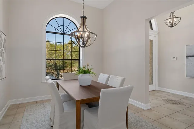 a spacious bathroom with a granite countertop sink a mirror a bathtub and a shower