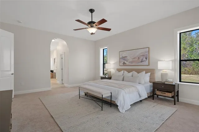 a view of a livingroom with furniture and a potted plant