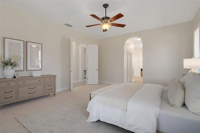 a bathroom with a sink toilet and a mirror