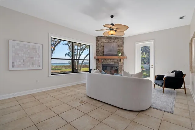 a view of a backyard with table and chairs under an umbrella