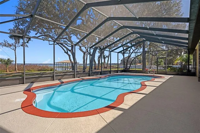 a kitchen with stainless steel appliances a sink stove and cabinets