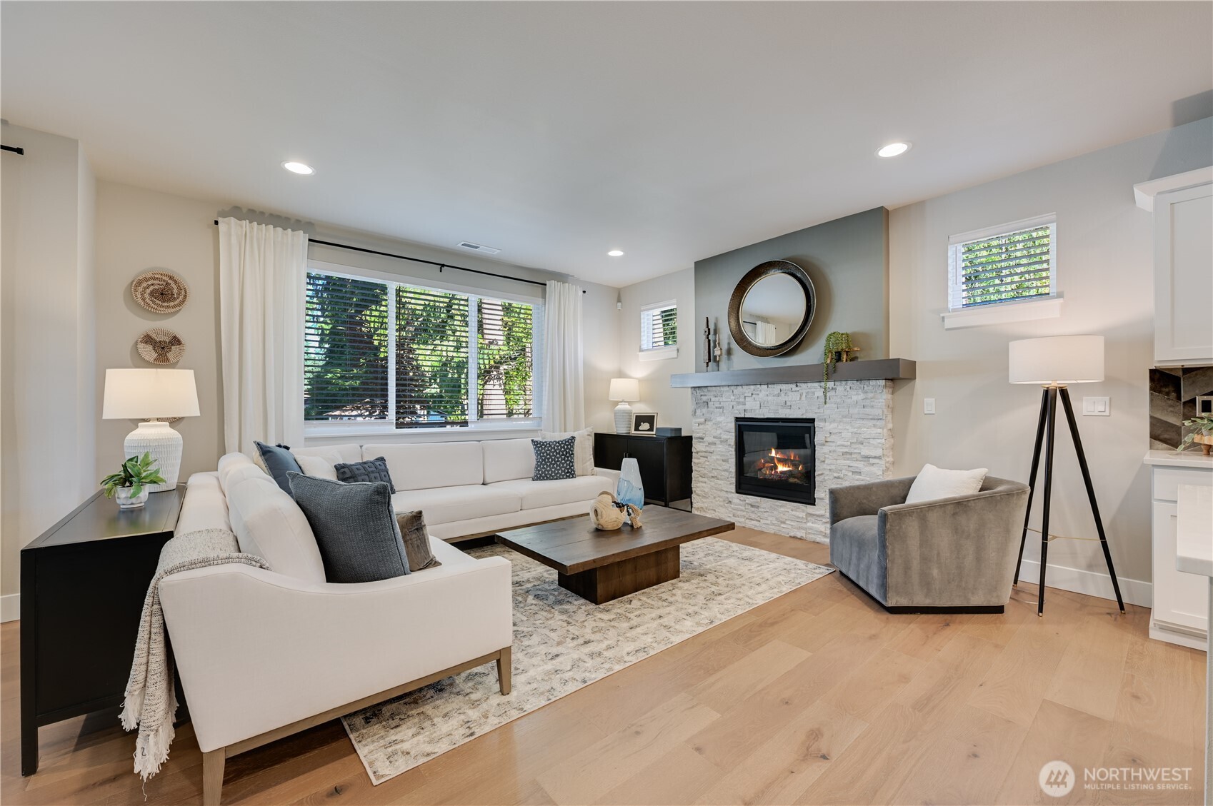 19221 Meridian Drive Southeast, Unit CW 16 Bothell, WA 98012 - Photo 12 of 37 a living room with furniture and a fireplace