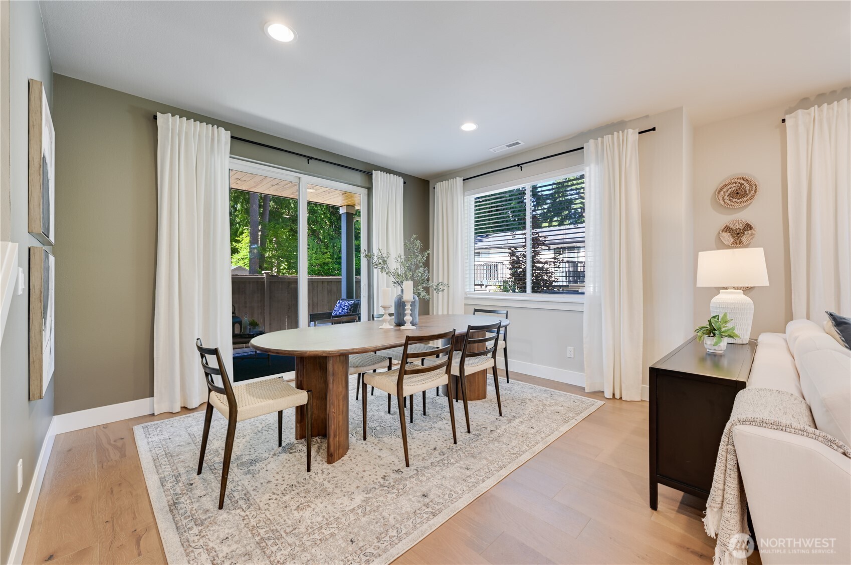 19221 Meridian Drive Southeast, Unit CW 16 Bothell, WA 98012 - Photo 15 of 37 a view of a dining room with furniture window and outside view
