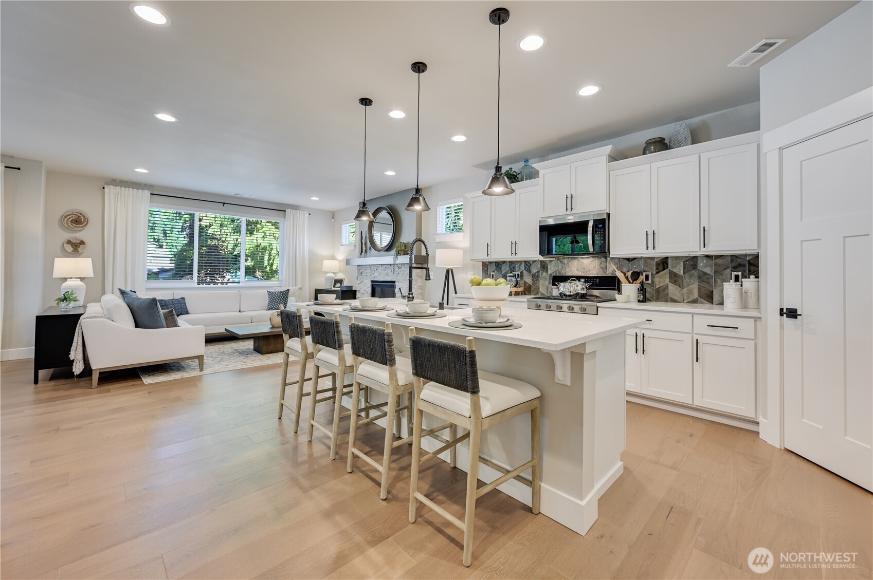 19221 Meridian Drive Southeast, Unit CW 16 Bothell, WA 98012 - Photo 8 of 37 a kitchen with a sink cabinets and window