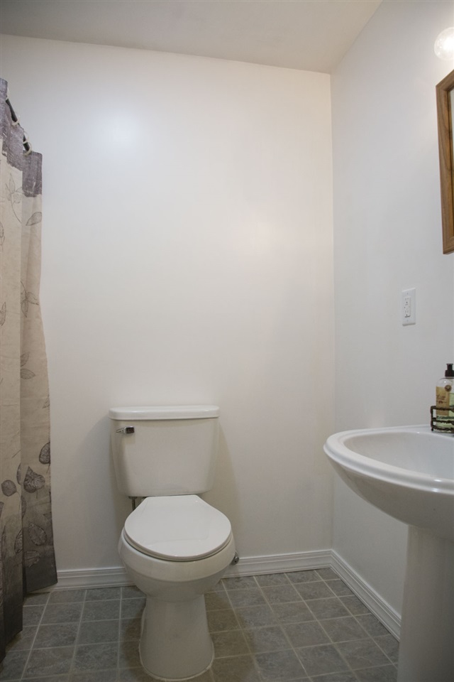 1380 New Hope Road Staunton, VA 24401 - Photo 11 of 28 a white toilet sitting next to a white sink
