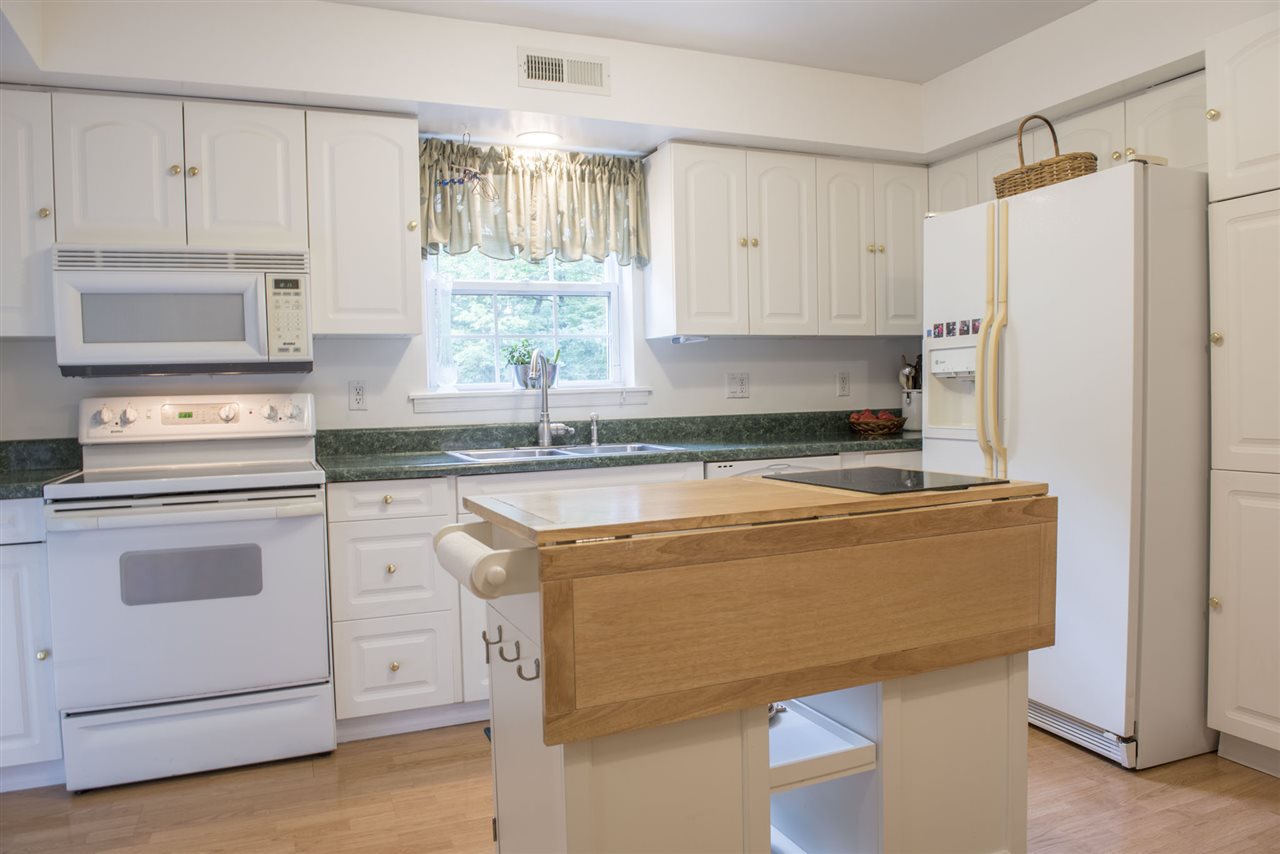 1380 New Hope Road Staunton, VA 24401 - Photo 5 of 28 a kitchen with a cabinets and white appliances