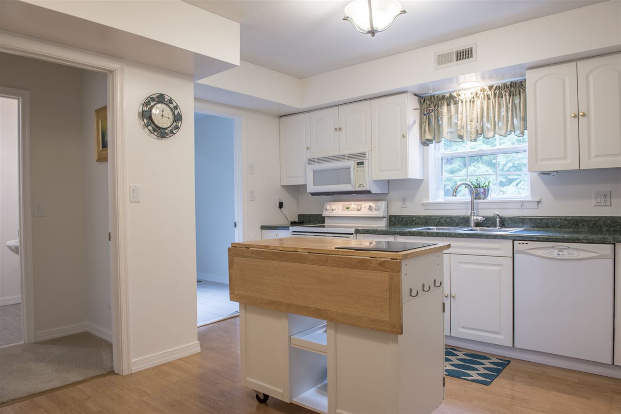1380 New Hope Road Staunton, VA 24401 - Photo 6 of 28 a kitchen with stainless steel appliances granite countertop a refrigerator sink and white cabinets