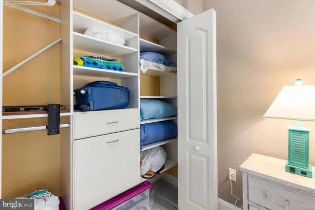 a bathroom with a double vanity sink toilet and a mirror