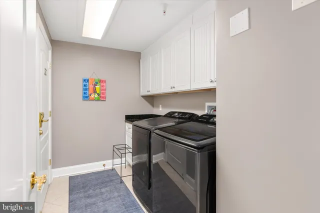 a view of living room with furniture and a lamp