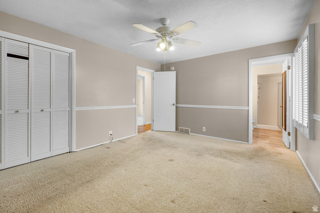 2088 Falcon Way Sandy, UT 84093 - Photo 24 of 46 Spacious room featuring neutral paint with chair rail molding, a ceiling fan with integrated lighting, and carpet flooring
