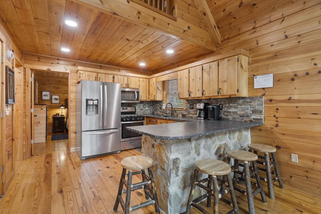 77 Old Covered Bridge Road Cherry Log, GA 30522 - Photo 12 of 40 a kitchen with stainless steel appliances granite countertop a refrigerator and a stove top oven