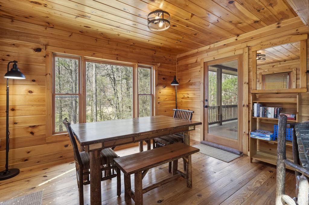 77 Old Covered Bridge Road Cherry Log, GA 30522 - Photo 13 of 40 a view of a dining room with furniture window and wooden floor
