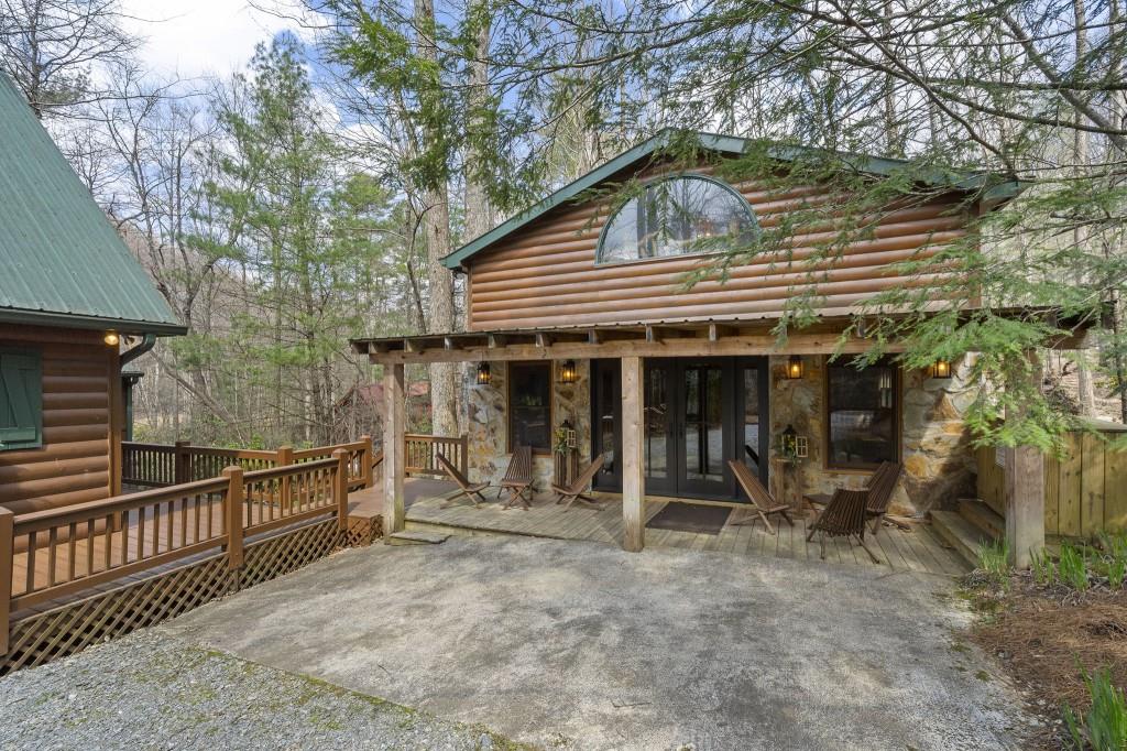 77 Old Covered Bridge Road Cherry Log, GA 30522 - Photo 23 of 40 a front view of a house with glass door and furniture