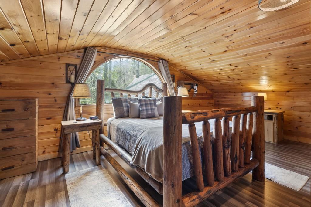 77 Old Covered Bridge Road Cherry Log, GA 30522 - Photo 29 of 40 a bedroom with a bed and a window