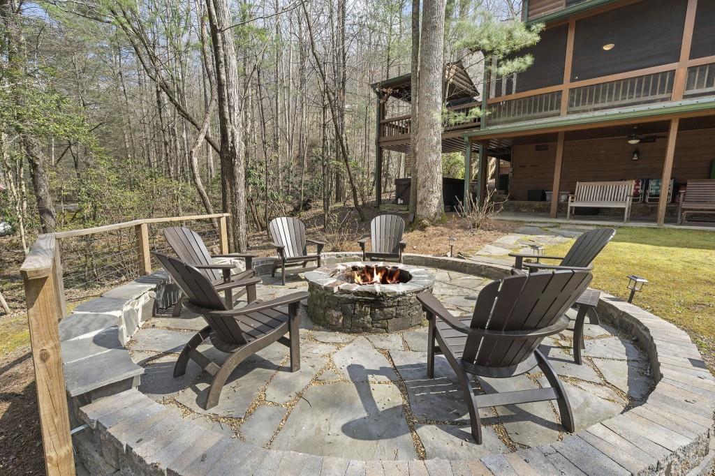 77 Old Covered Bridge Road Cherry Log, GA 30522 - Photo 34 of 40 a view of a patio with table and chairs and potted plants