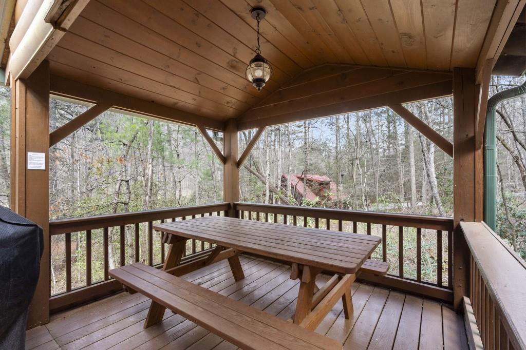77 Old Covered Bridge Road Cherry Log, GA 30522 - Photo 36 of 40 a view of a balcony with furniture and wooden floor