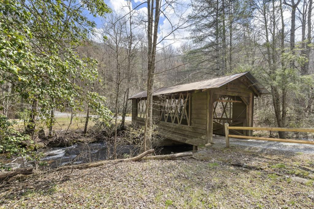 77 Old Covered Bridge Road Cherry Log, GA 30522 - Photo 40 of 40 a front view of a house with garden