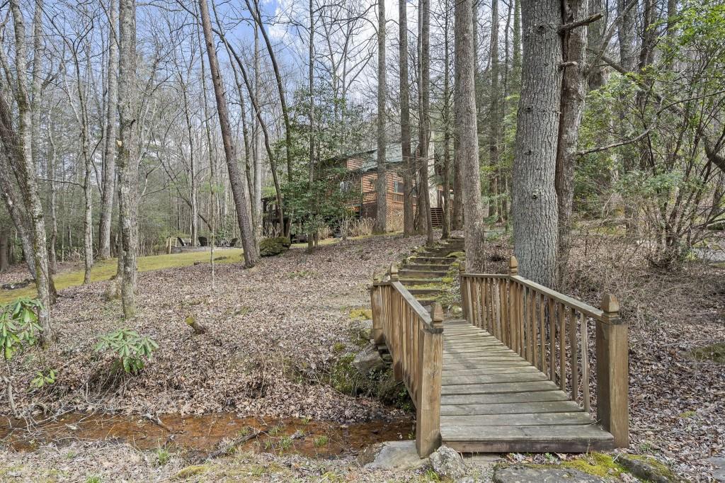 77 Old Covered Bridge Road Cherry Log, GA 30522 - Photo 4 of 40 a view of a house with a yard