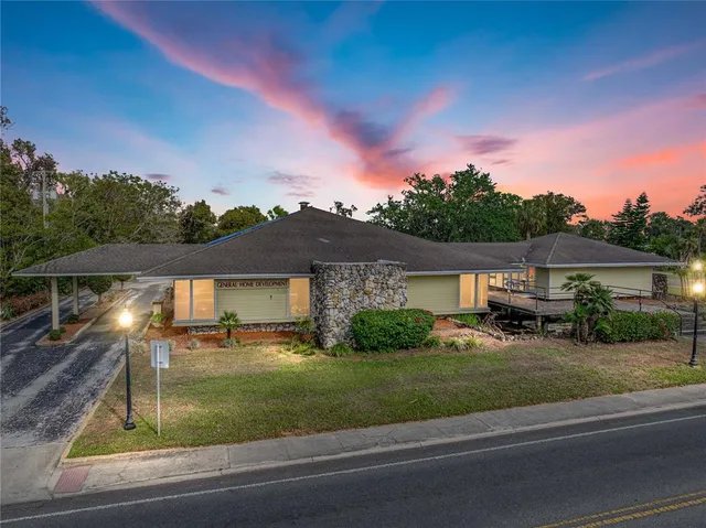 a view of a house with a yard