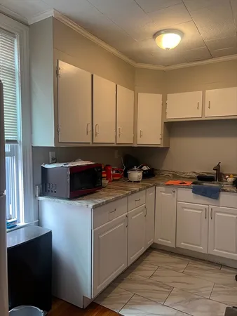a kitchen with stainless steel appliances granite countertop a sink and a stove