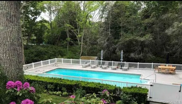 a view of a swimming pool with a patio