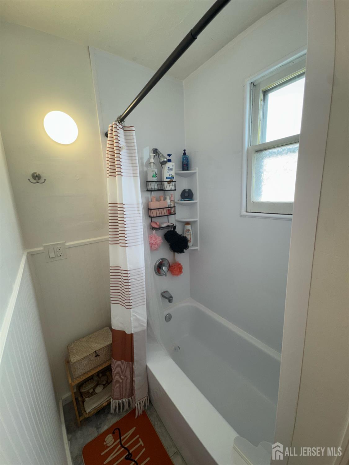 41 Atlantic Street Keyport, NJ 07735 - Photo 13 of 48 a bathroom with a bathtub a toilet and a shower