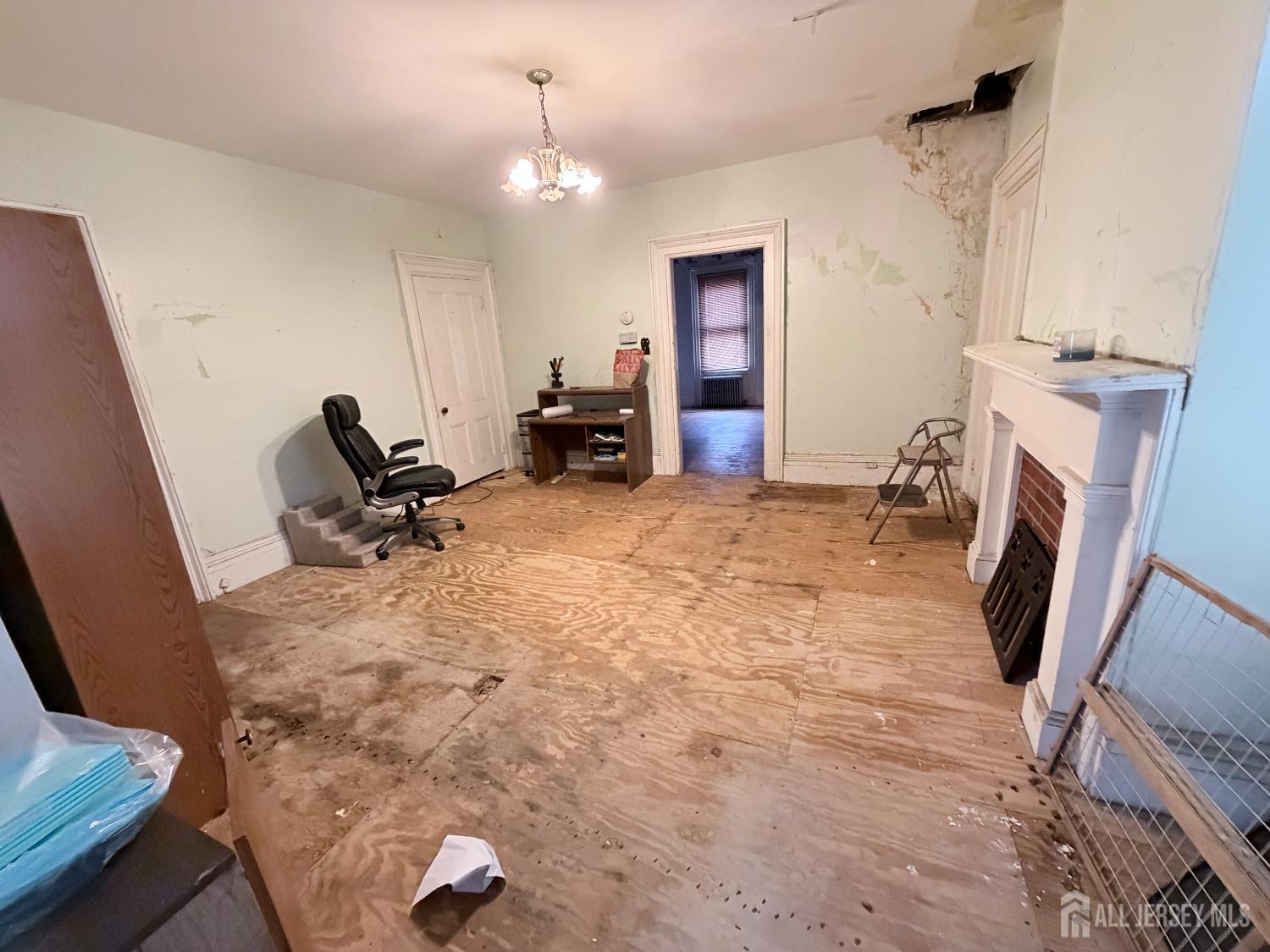 41 Atlantic Street Keyport, NJ 07735 - Photo 14 of 48 a view of a livingroom with furniture and a fireplace