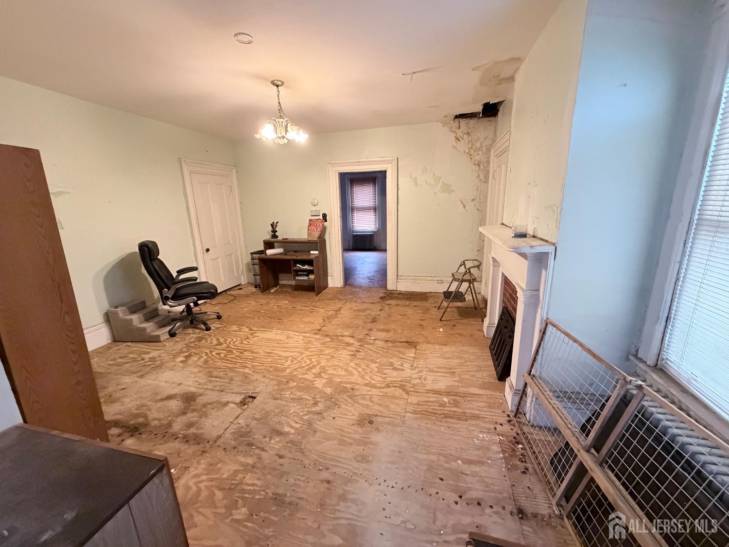 41 Atlantic Street Keyport, NJ 07735 - Photo 19 of 48 a room with furniture and a fireplace