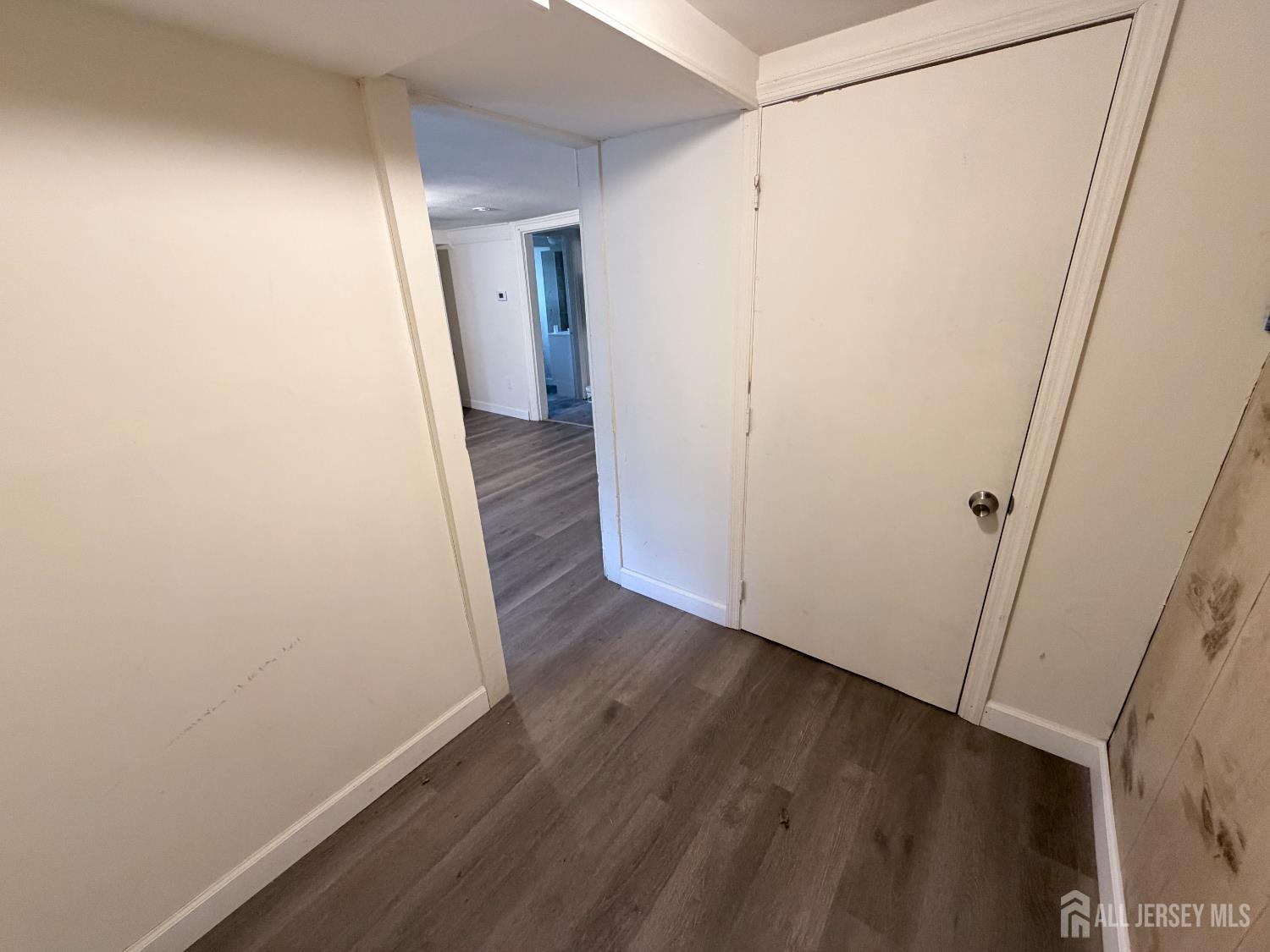 41 Atlantic Street Keyport, NJ 07735 - Photo 27 of 48 a view of a hallway with wooden floor