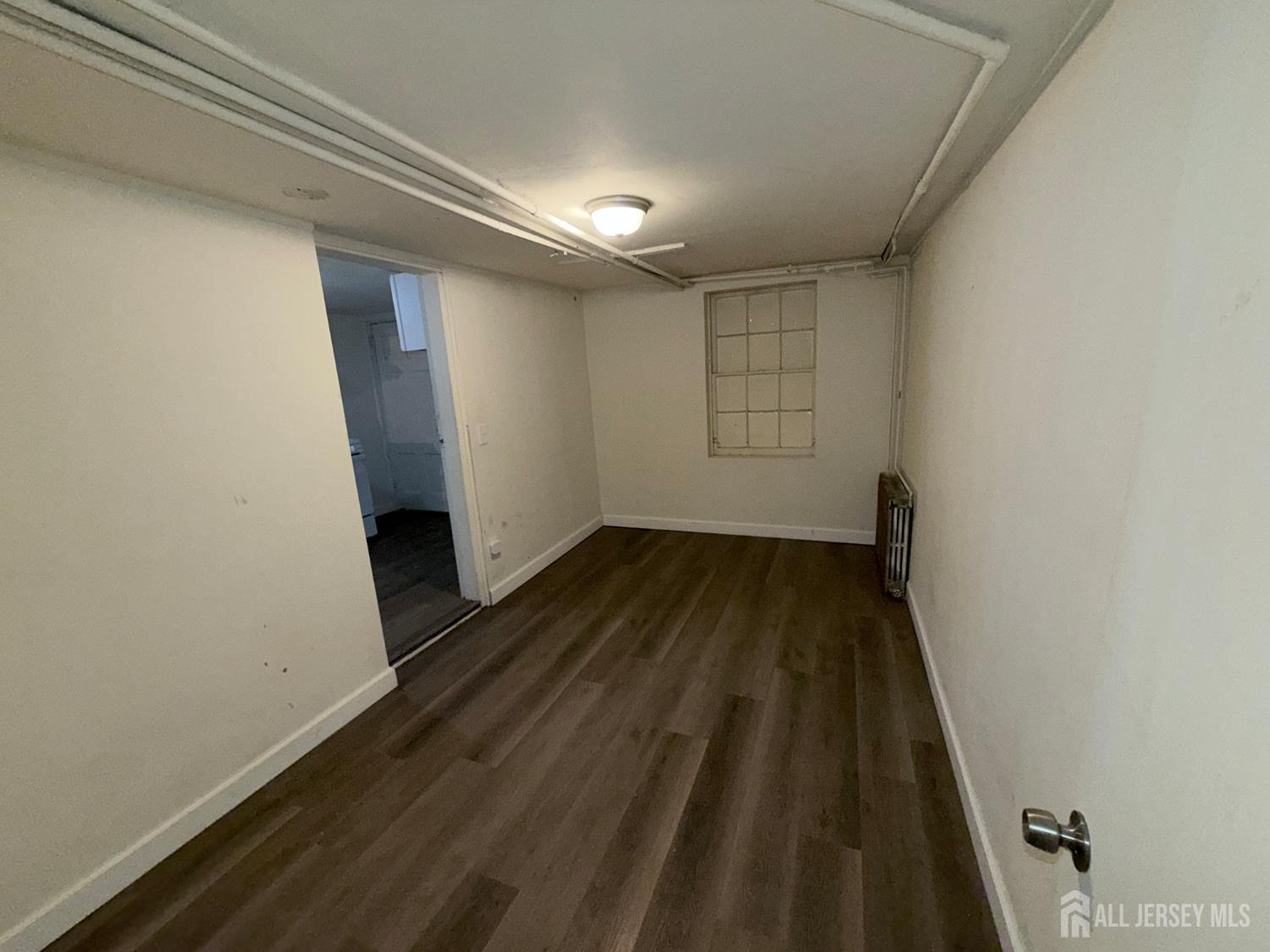 41 Atlantic Street Keyport, NJ 07735 - Photo 34 of 48 a view of empty room with wooden floor
